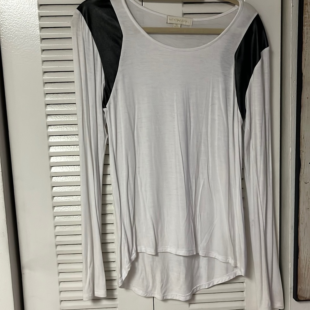 Nikki Minaj brand white body with black leather sleeves.